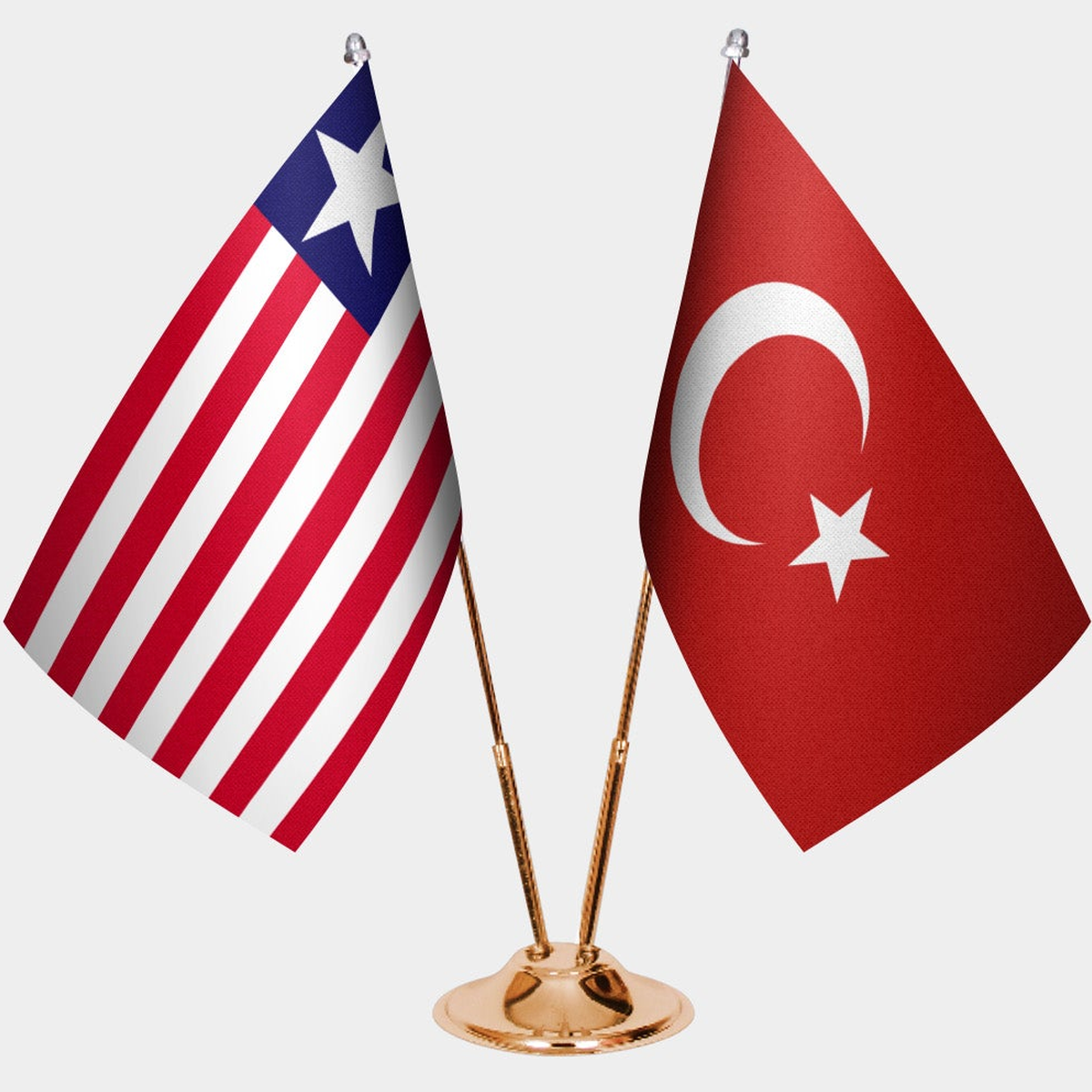 Liberia and Türkiye dual desk flag set with gold pedestal, satin office table flag