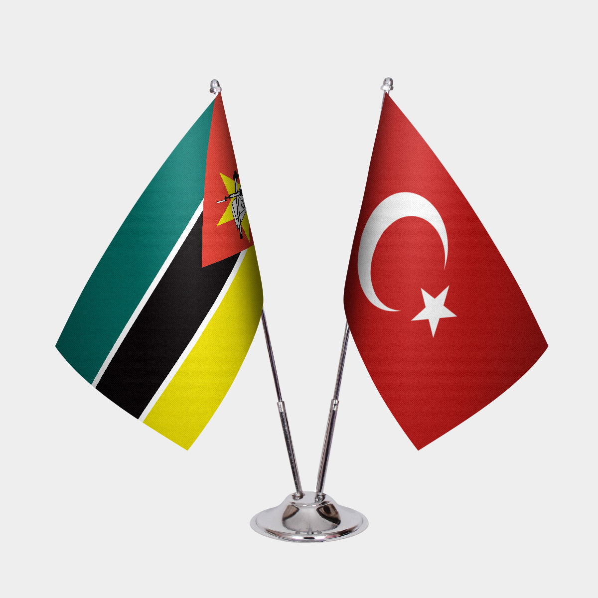 Mozambique and Türkiye dual desk flag set with chrome silver pedestal, satin office table flag