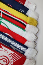 Close-up of woven scarf fringes showing premium fabric texture and reinforced edges