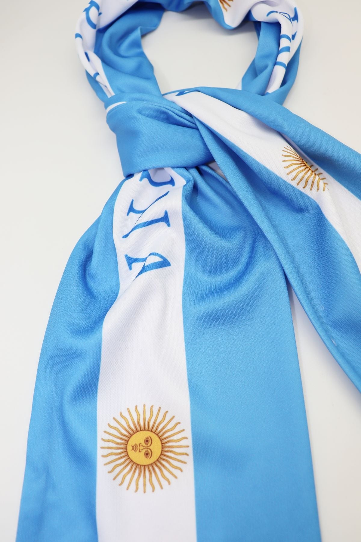 Argentina Flag Satin Soccer Scarf close-up of the satin-look fabric, print and white fringe