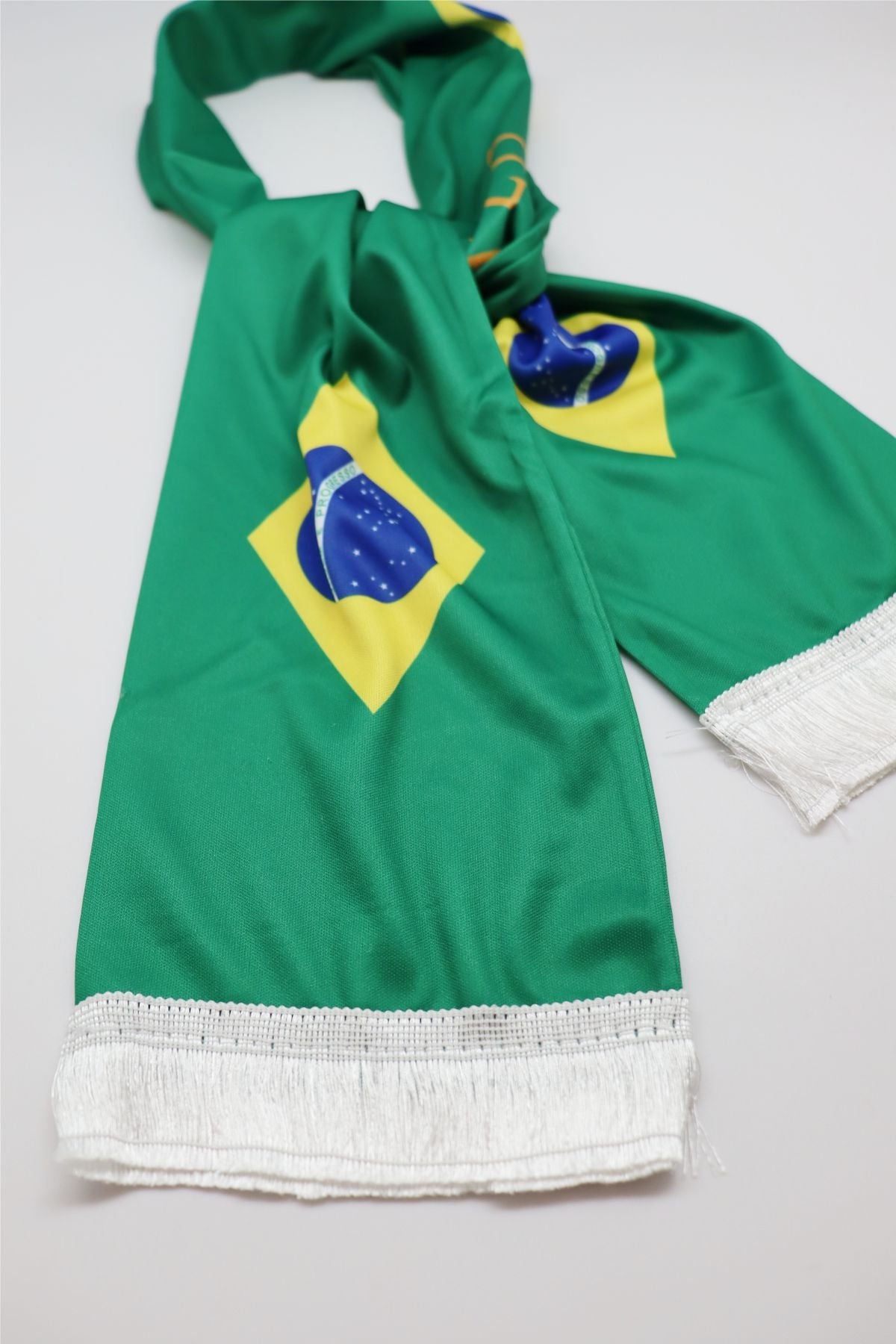 Brazil Flag Satin Soccer Scarf close-up of the satin-look fabric, print and white fringe