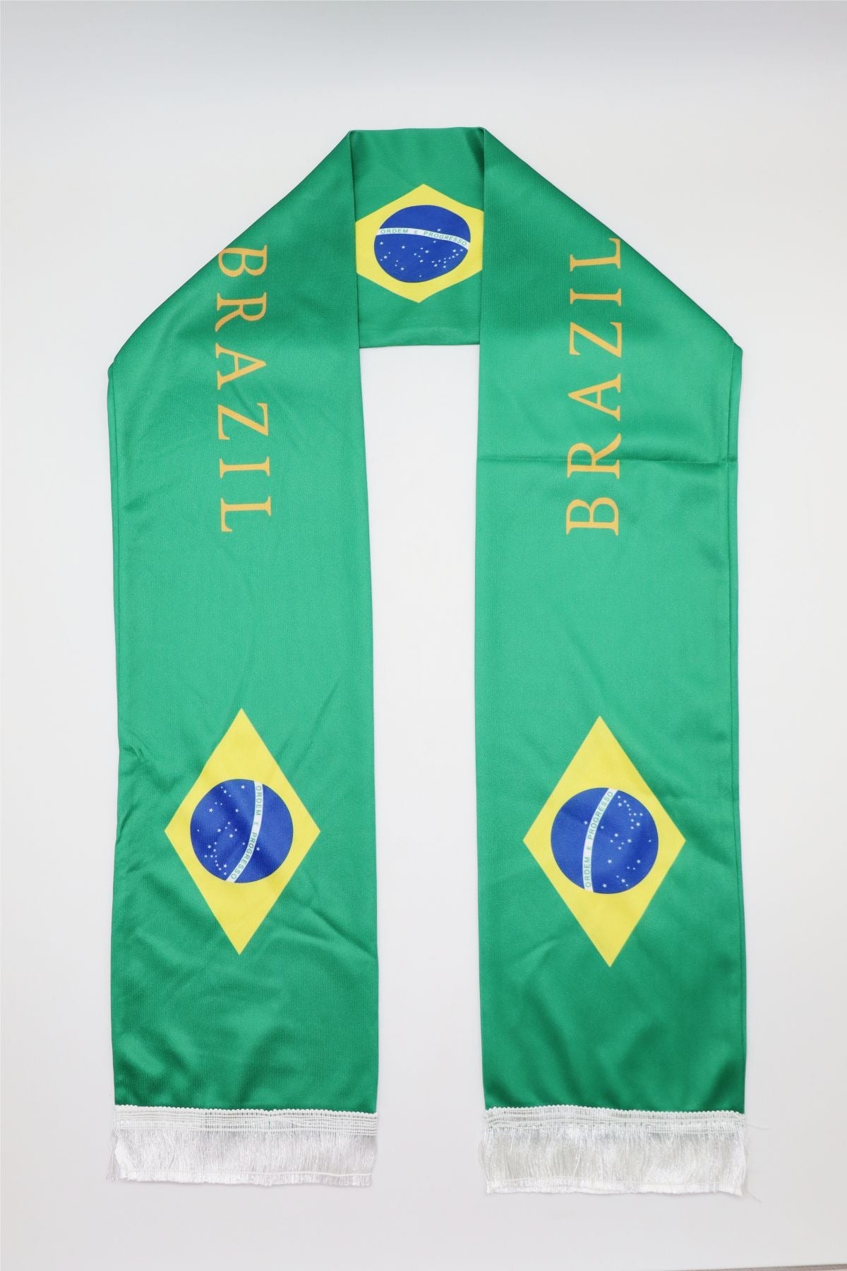 Brazil Flag Satin Soccer Scarf laid flat, full length with BRAZIL lettering and white fringes