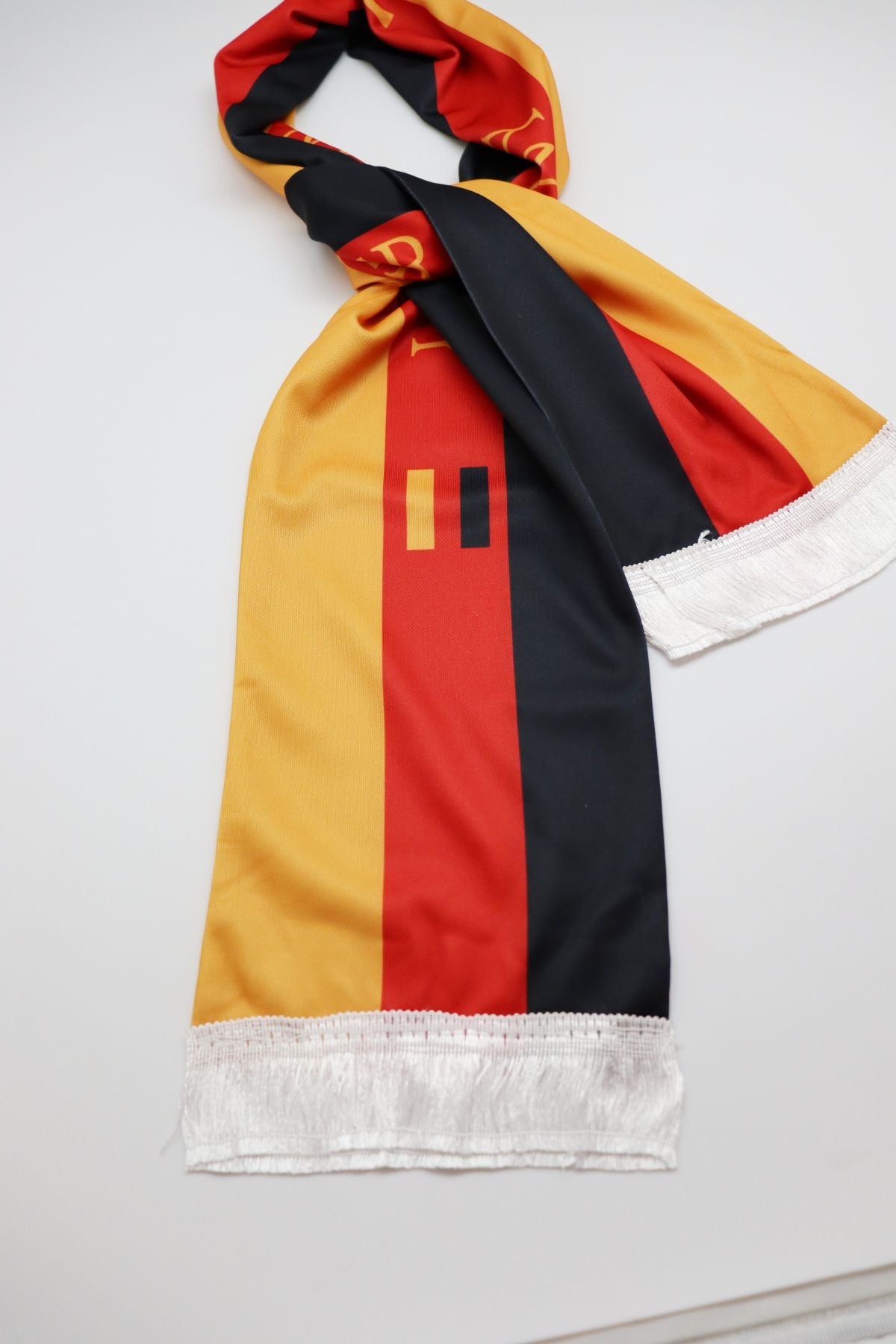 Germany Flag Satin Soccer Scarf close-up of the satin-look fabric, print and white fringe