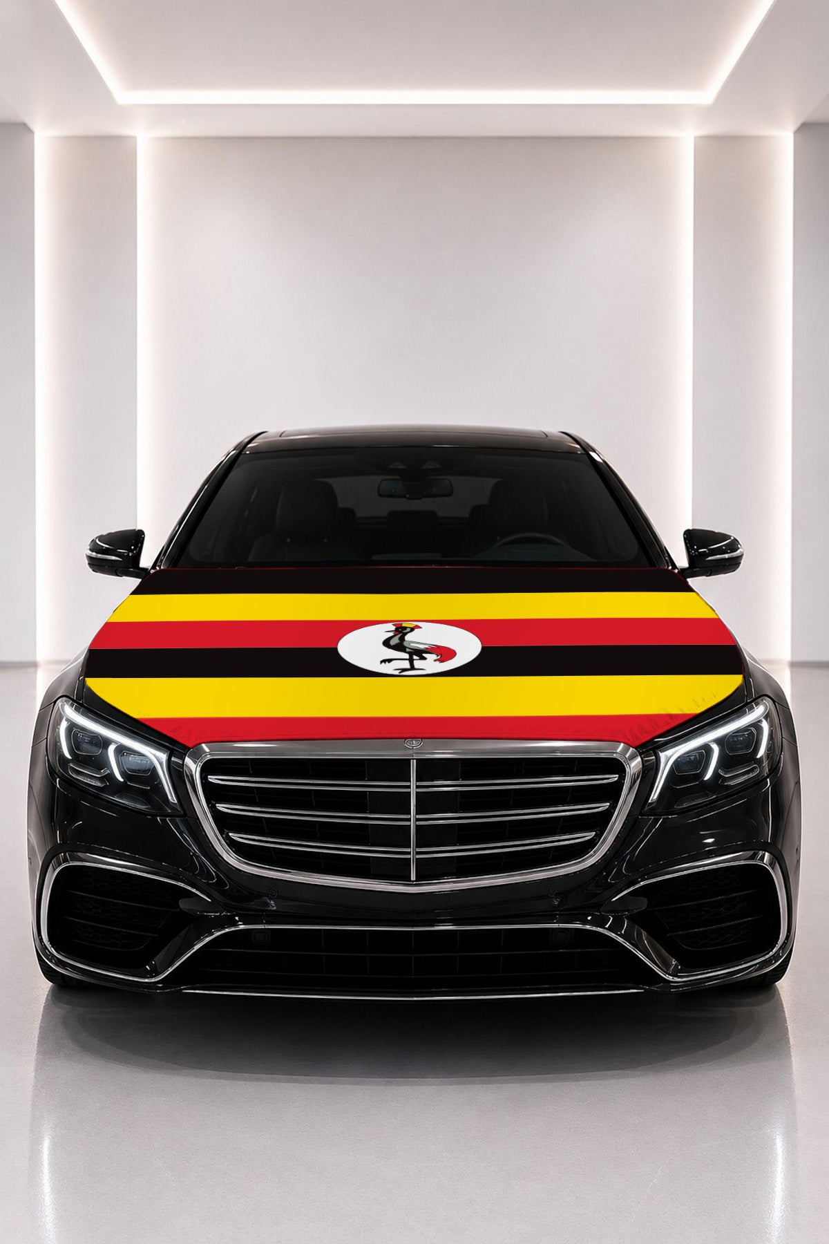 Uganda flag car hood cover fitted on a black car bonnet