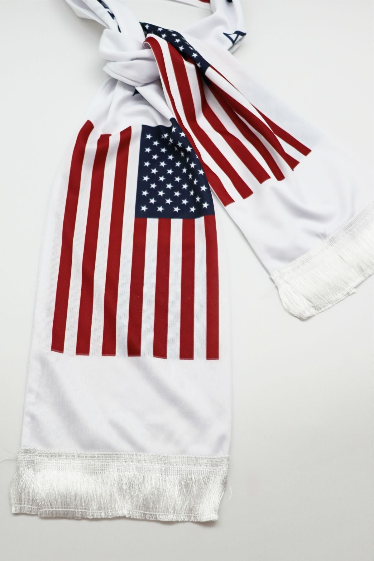 USA Flag Satin Soccer Scarf close-up of the satin-look fabric, print and white fringe