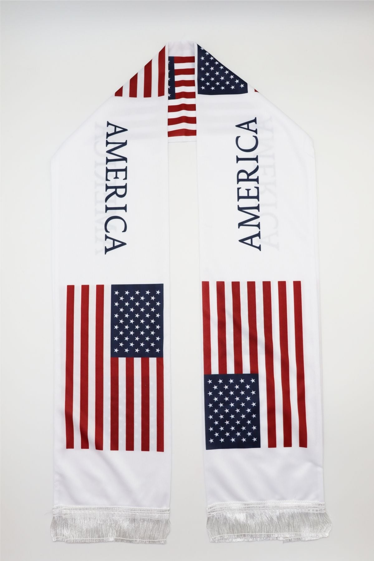USA Flag Satin Soccer Scarf laid flat, full length with AMERICA lettering and white fringes