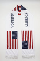 USA Flag Satin Soccer Scarf laid flat, full length with AMERICA lettering and white fringes